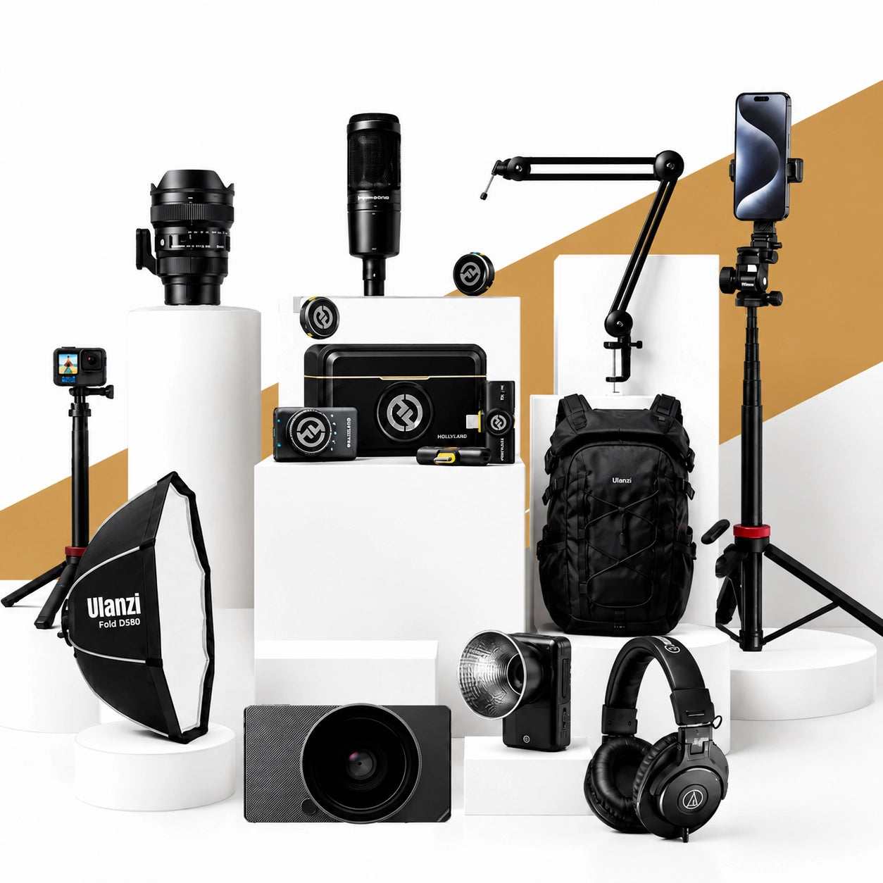 A studio setup of photography and audio accessories. Visible items include a softbox, camera lens, microphone, smartphone on a tripod, backpack, camera body, camera accessories, headphones of hope enterprises.